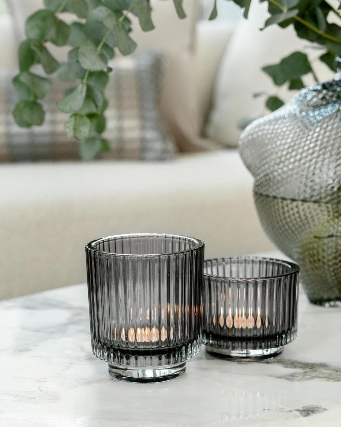 Loucille Storms candle holders in grey, shown in a lifestyle left view as image 6