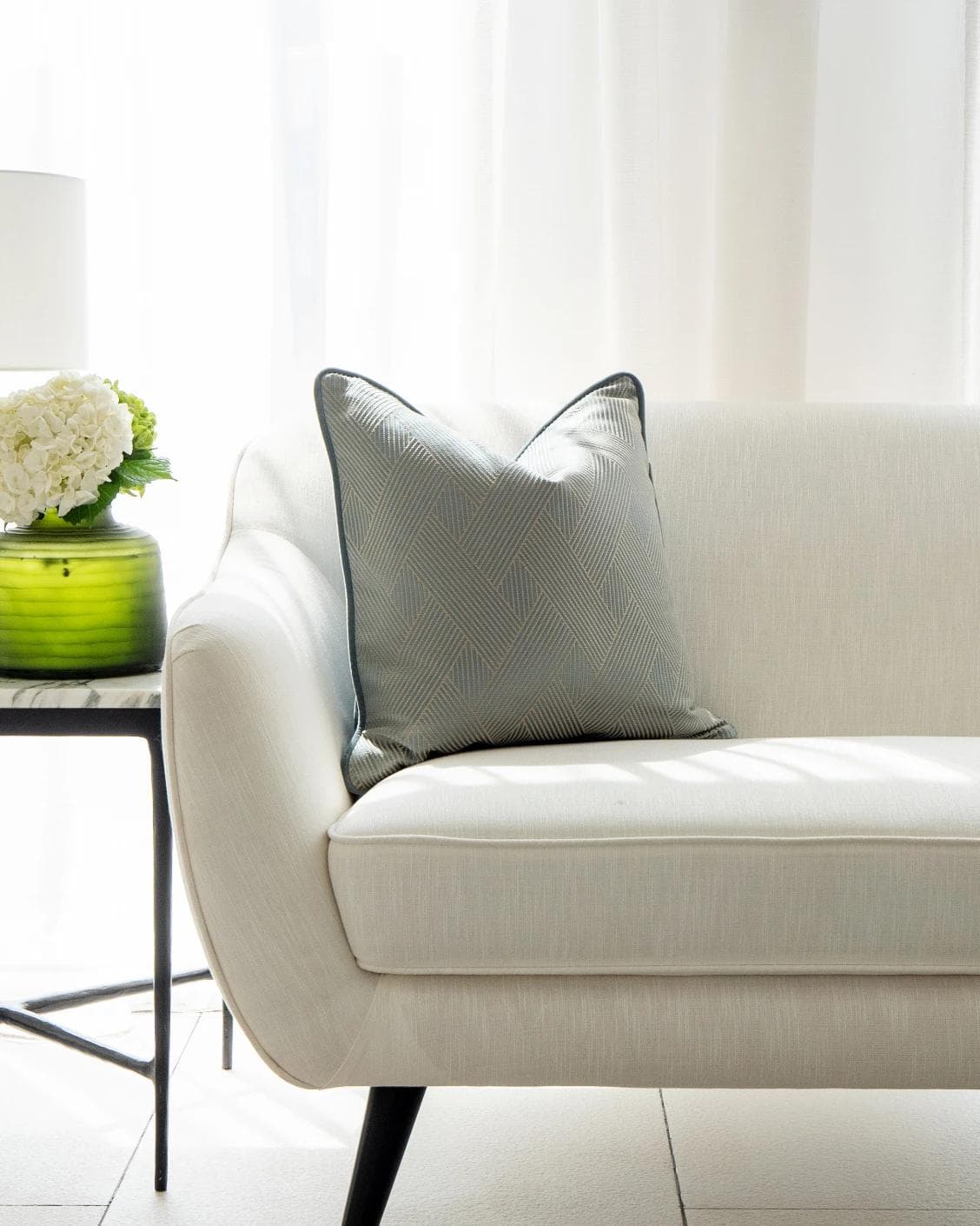 Lucas Matisse cushion in blue, shown in a lifestyle front view as image 4