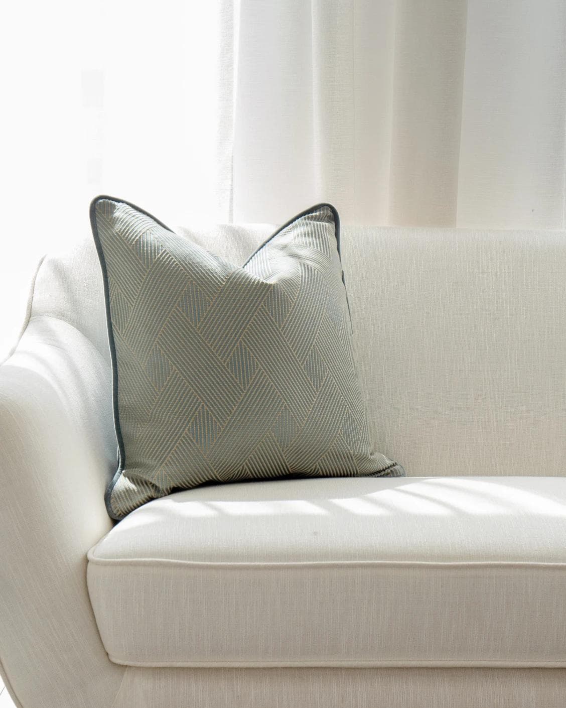 Lucas Matisse cushion in blue, shown in a lifestyle front view as image 5