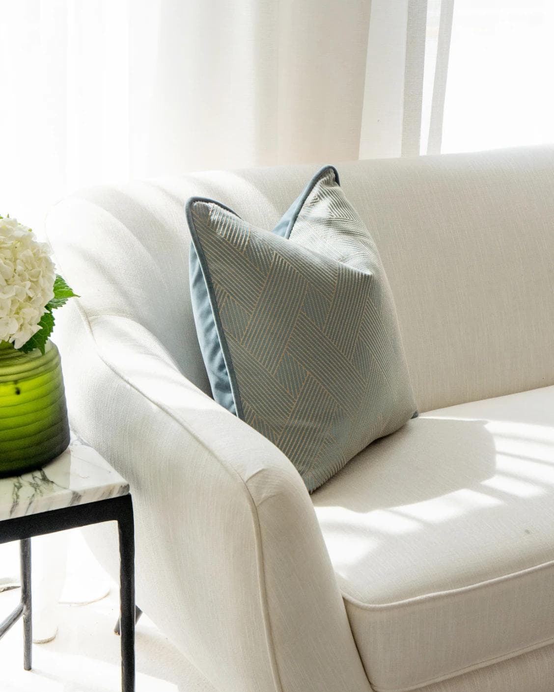 Lucas Matisse cushion in blue, shown in a lifestyle left view as image 6