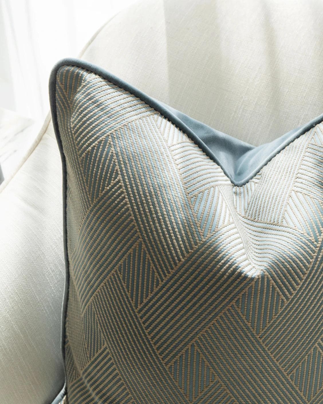 Lucas Matisse cushion in blue, shown in a lifestyle top view as image 7
