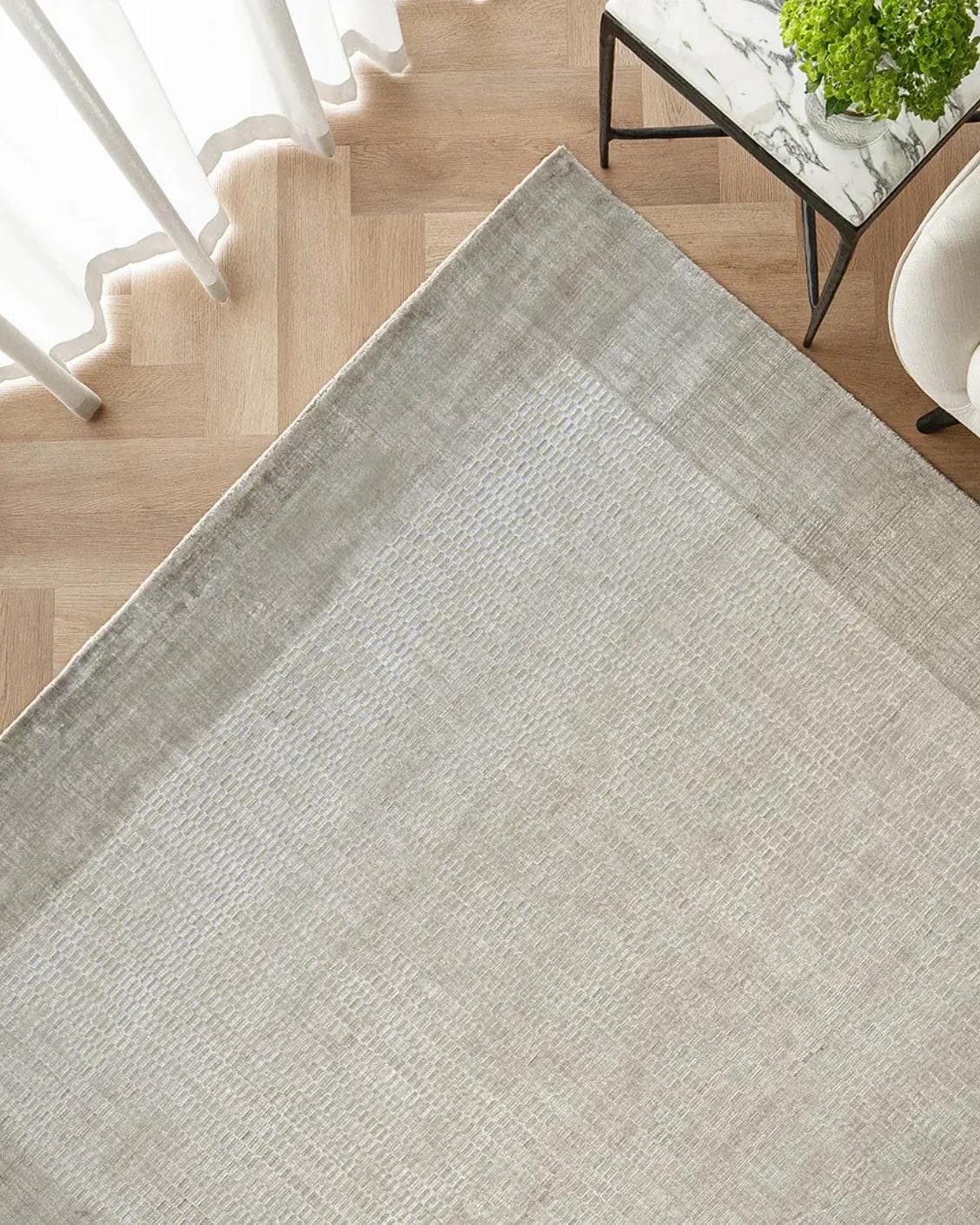 Luna Dune carpet in taupe, brown and beige, shown in a lifestyle top view as image 2