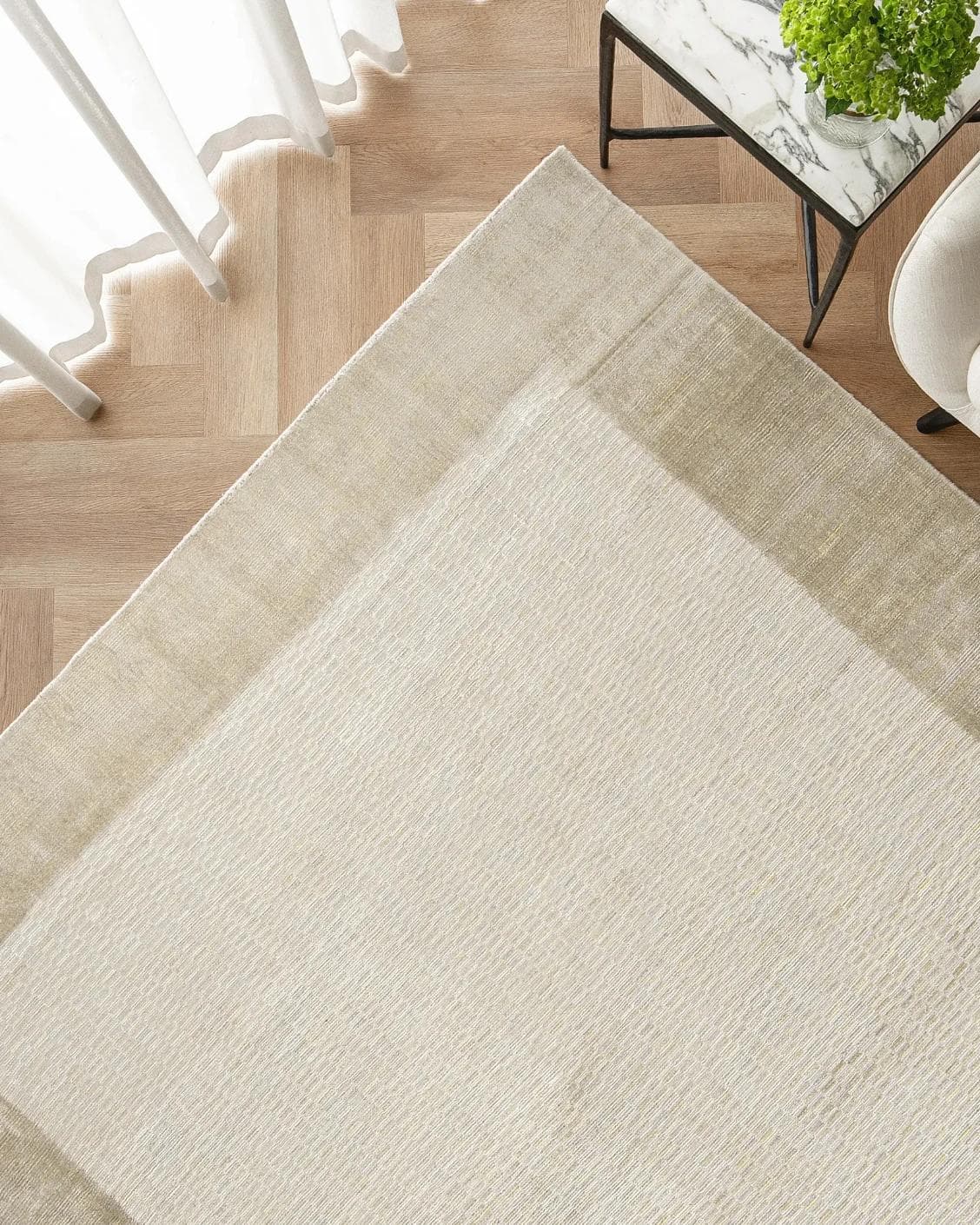 Luna Sandy carpet in beige, shown in a lifestyle top view as image 2