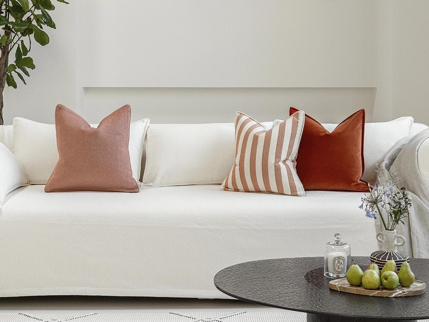 Lux Bundle cushion in rust and pink, shown in a lifestyle front view as image 4