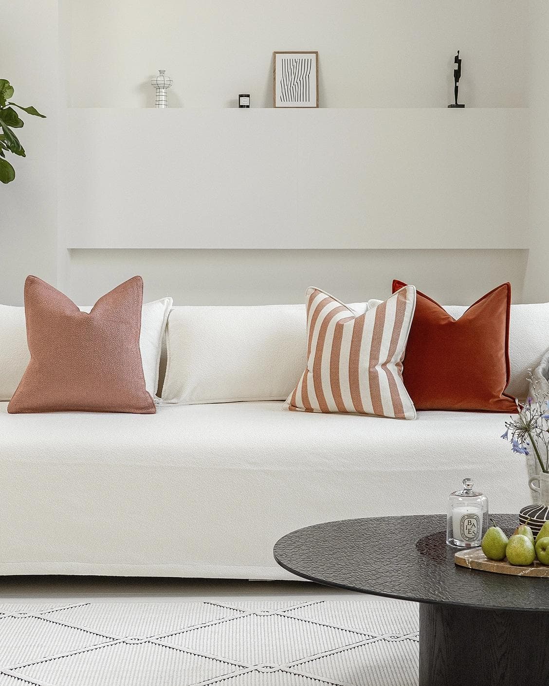 Lux Bundle cushion in rust and pink, shown in a lifestyle front view as image 4