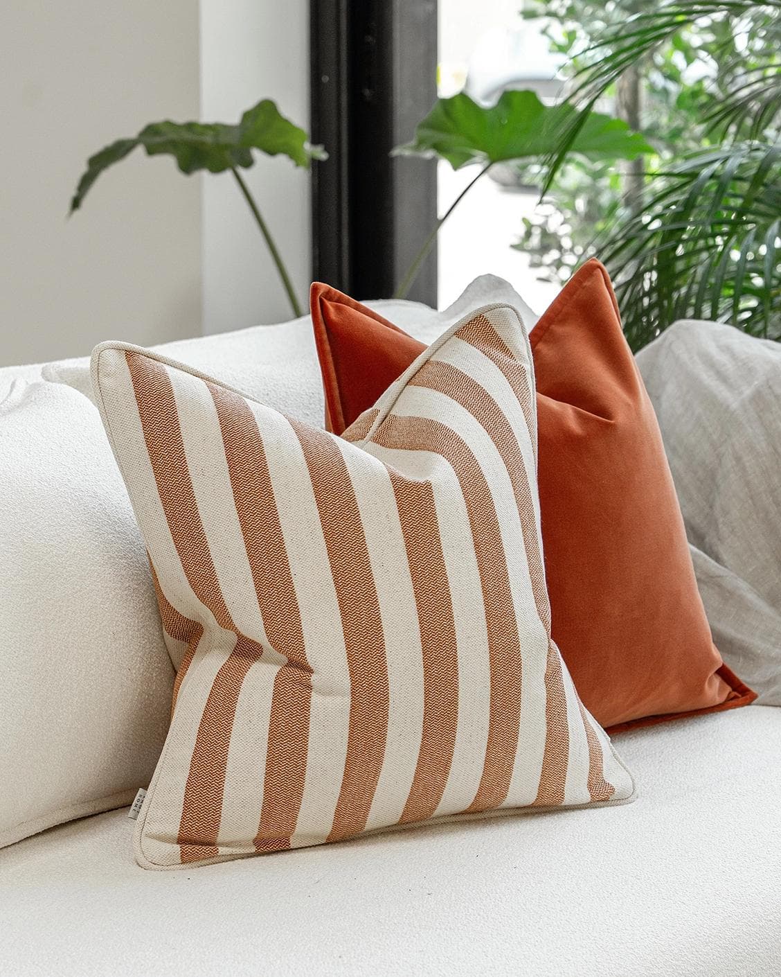 Lux Bundle cushion in rust and pink, shown in a product left view as image 5