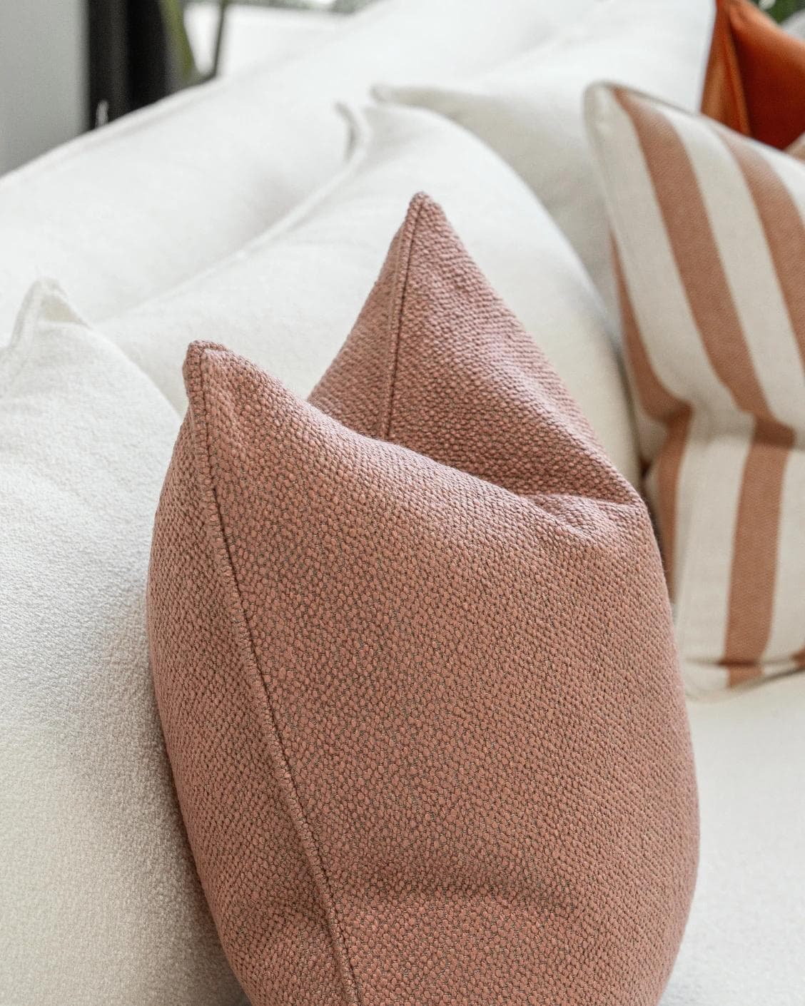 Lux Bundle cushion in rust and pink, shown in a product left view as image 6