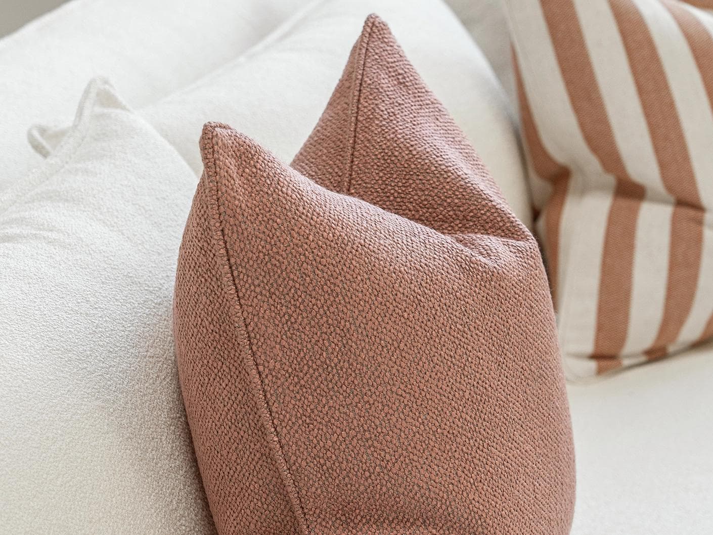 Lux Bundle cushion in rust and pink, shown in a product left view as image 6