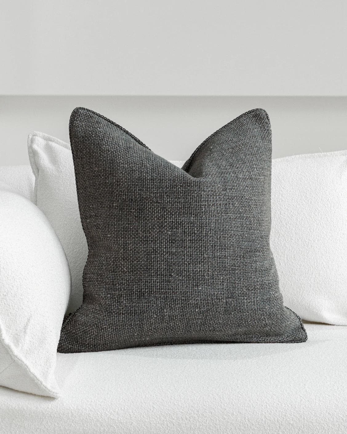 Lynn Canova cushion in blue, shown in a lifestyle front view as image 2