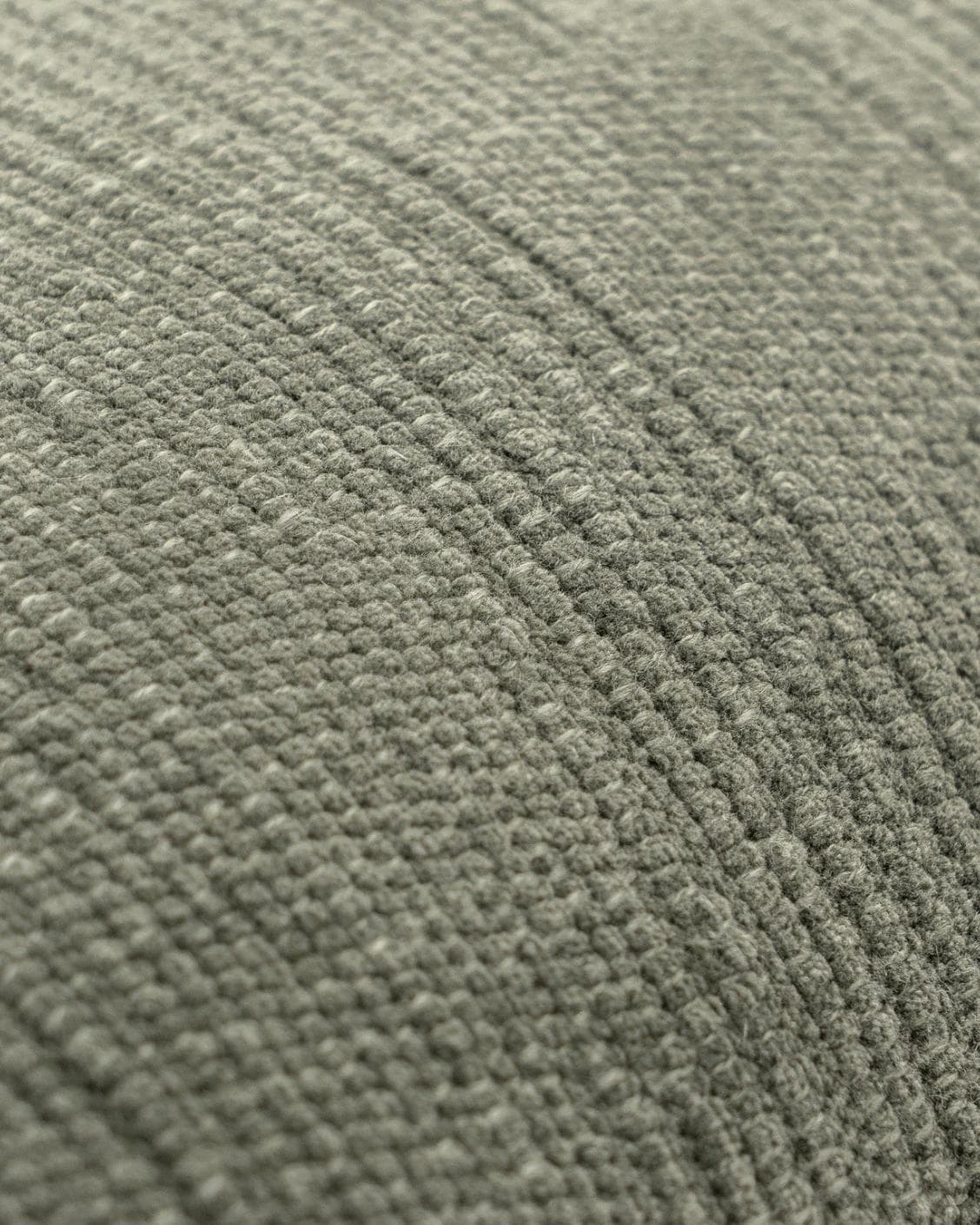 Macey Jade cushion in grey and green, shown in a product close-up as image 6