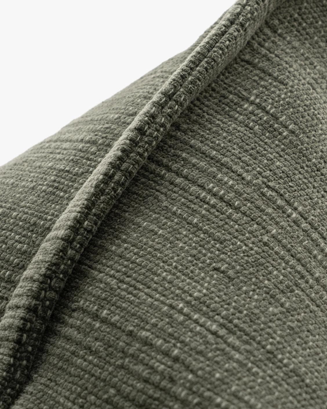 Macey Jade cushion in grey and green, shown in a product close-up as image 7