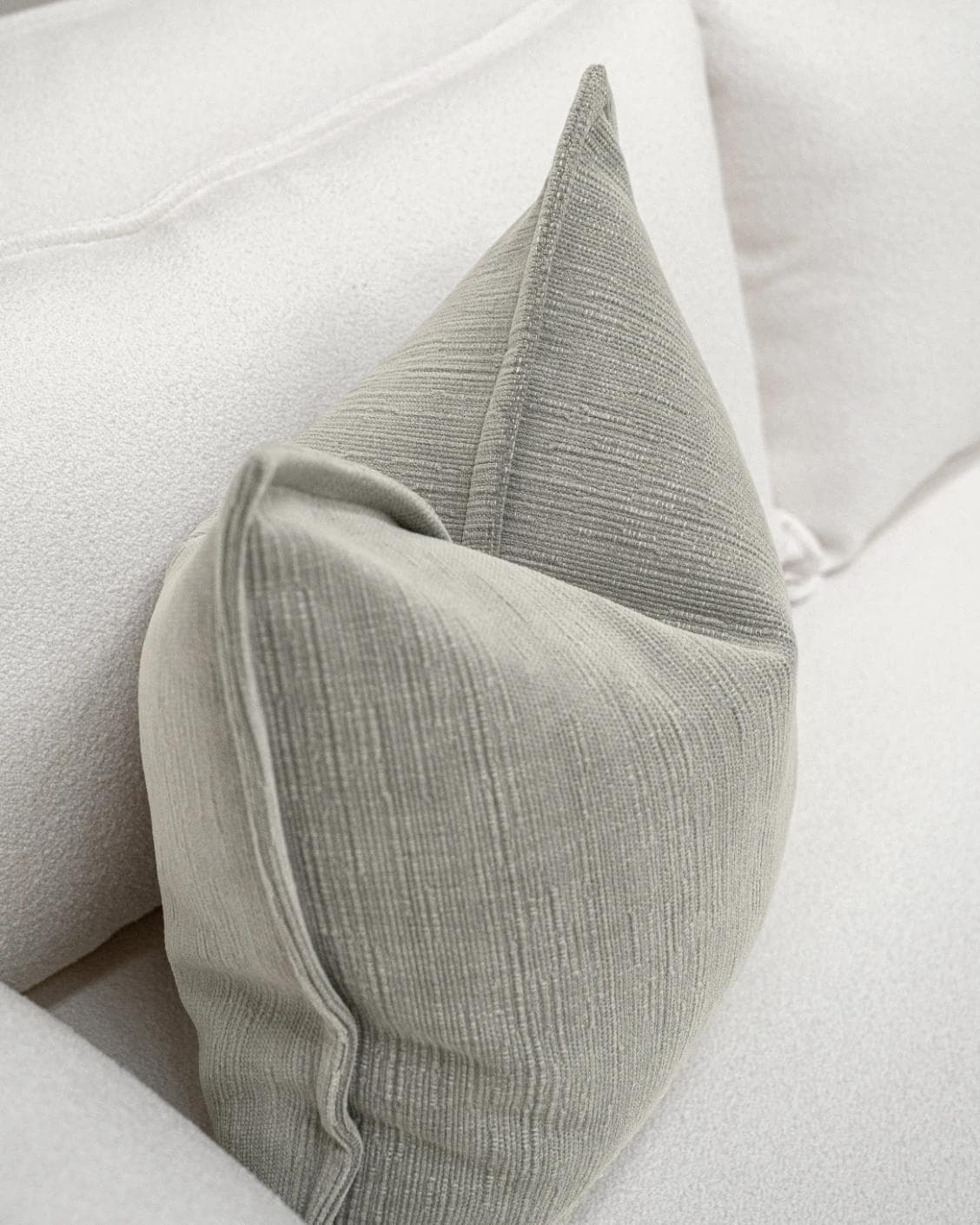 Macey Laurent cushion in grey, shown in a lifestyle top view as image 5