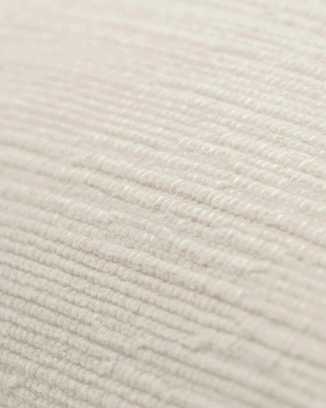 Macey Shale cushion in ivory, shown in a product close-up as image 5