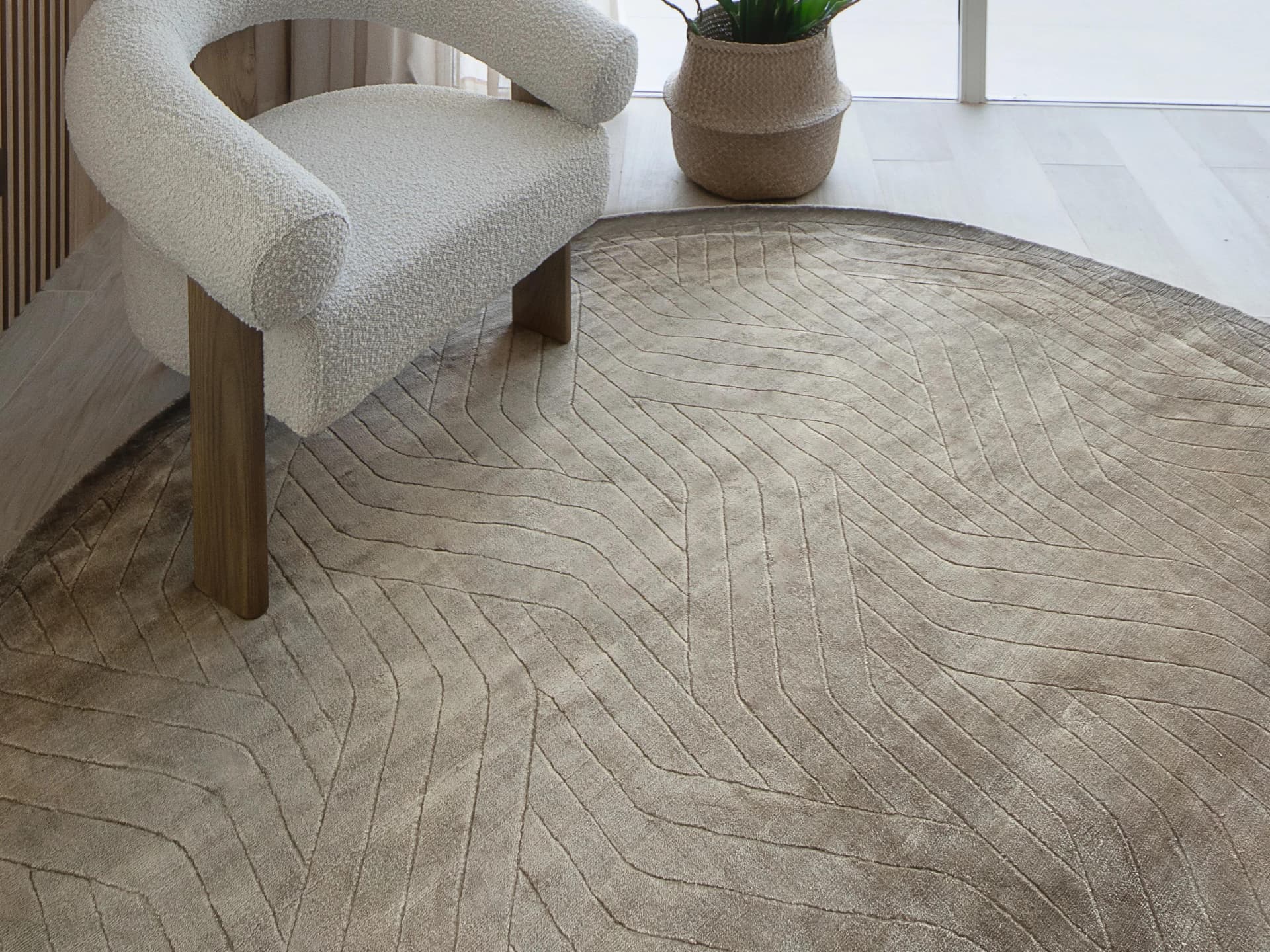Madox Sandy Round carpets in sandy and taupe, shown in a lifestyle top view as image 3