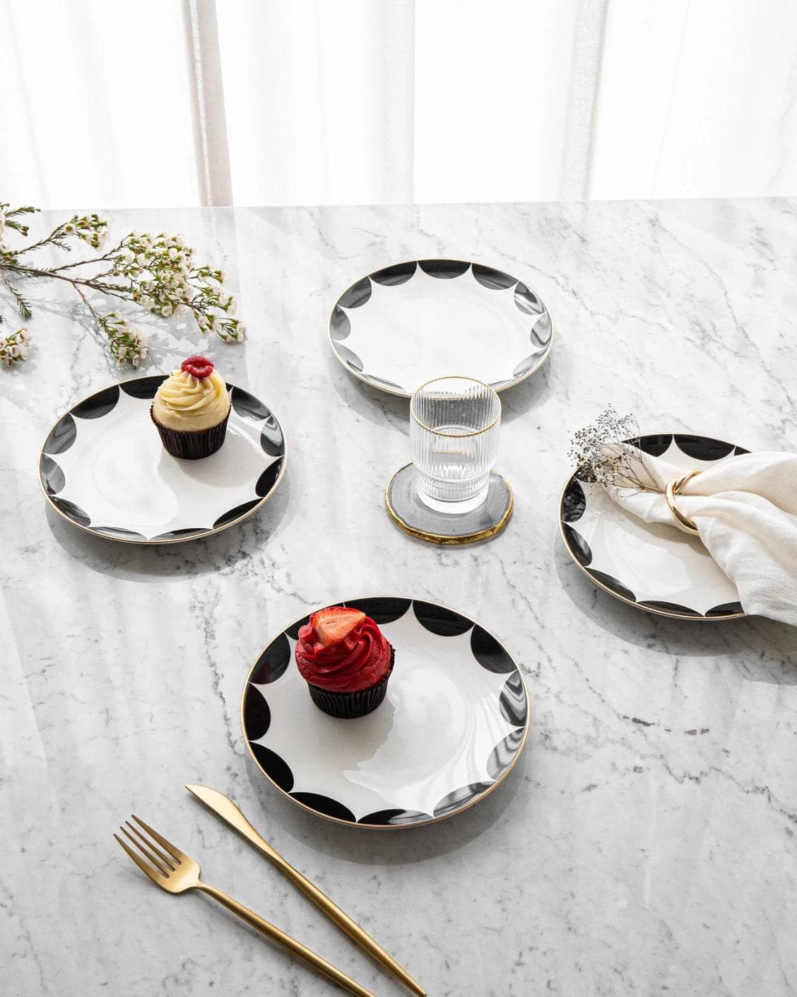 Malikka Viktoria plates in black and white, shown in a lifestyle top view as image 6