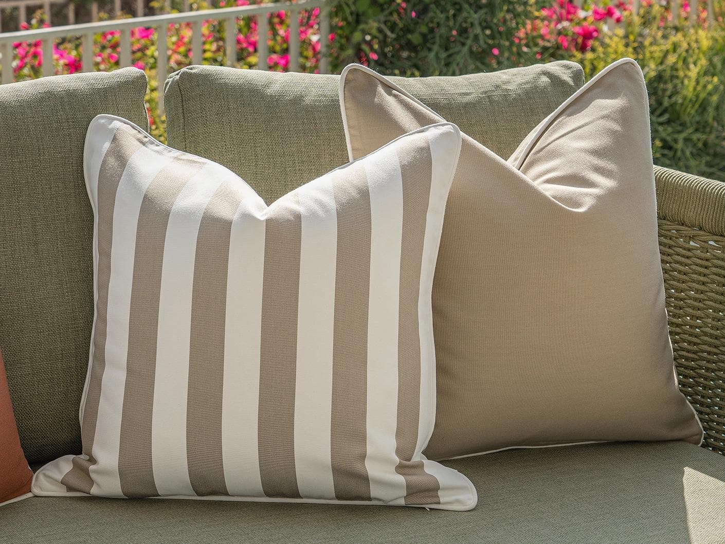 Manha Bundle cushion in rust and beige, shown in a lifestyle left view as image 6
