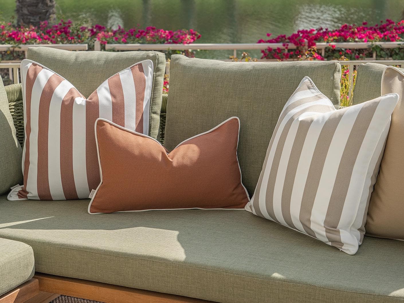 Manha Bundle cushion in rust and beige, shown in a lifestyle right view as image 7