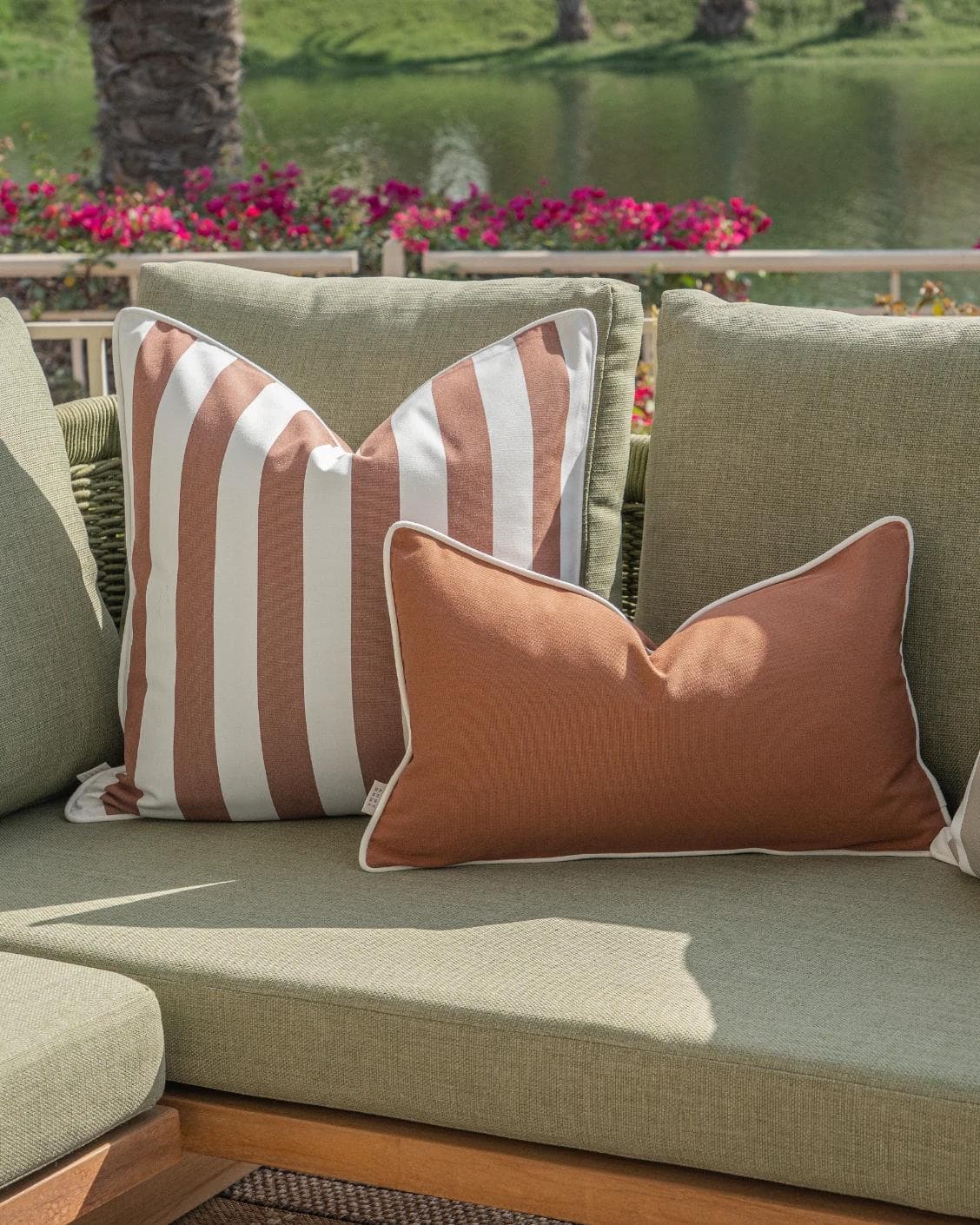 Manha Bundle cushion in rust and beige, shown in a lifestyle right view as image 7