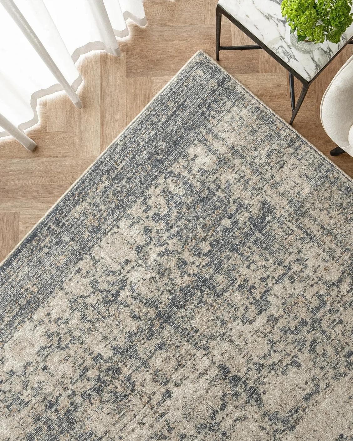 Marco Azure carpet in cream, grey and beige, shown in a lifestyle top view as image 2