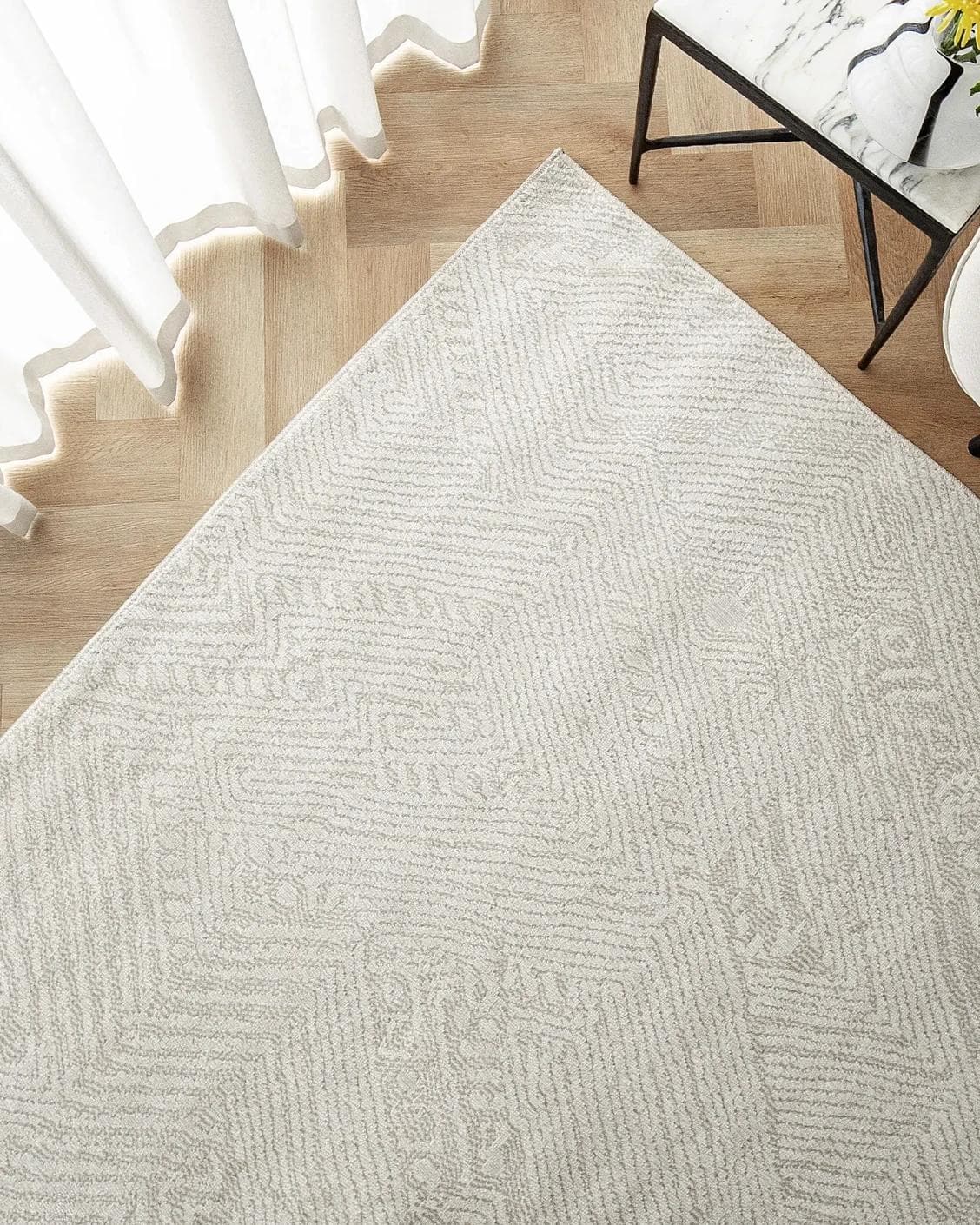 Marco Sandy carpet in beige, shown in a lifestyle top view as image 2