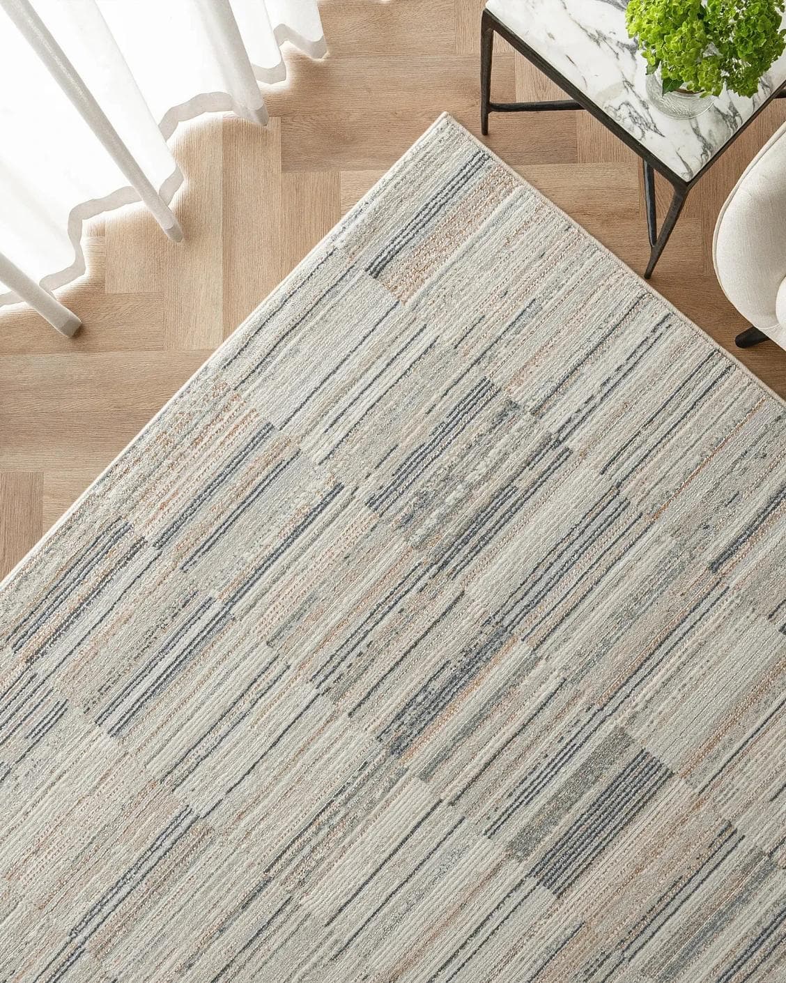 Marco Stone carpet in beige and grey, shown in a lifestyle top view as image 2