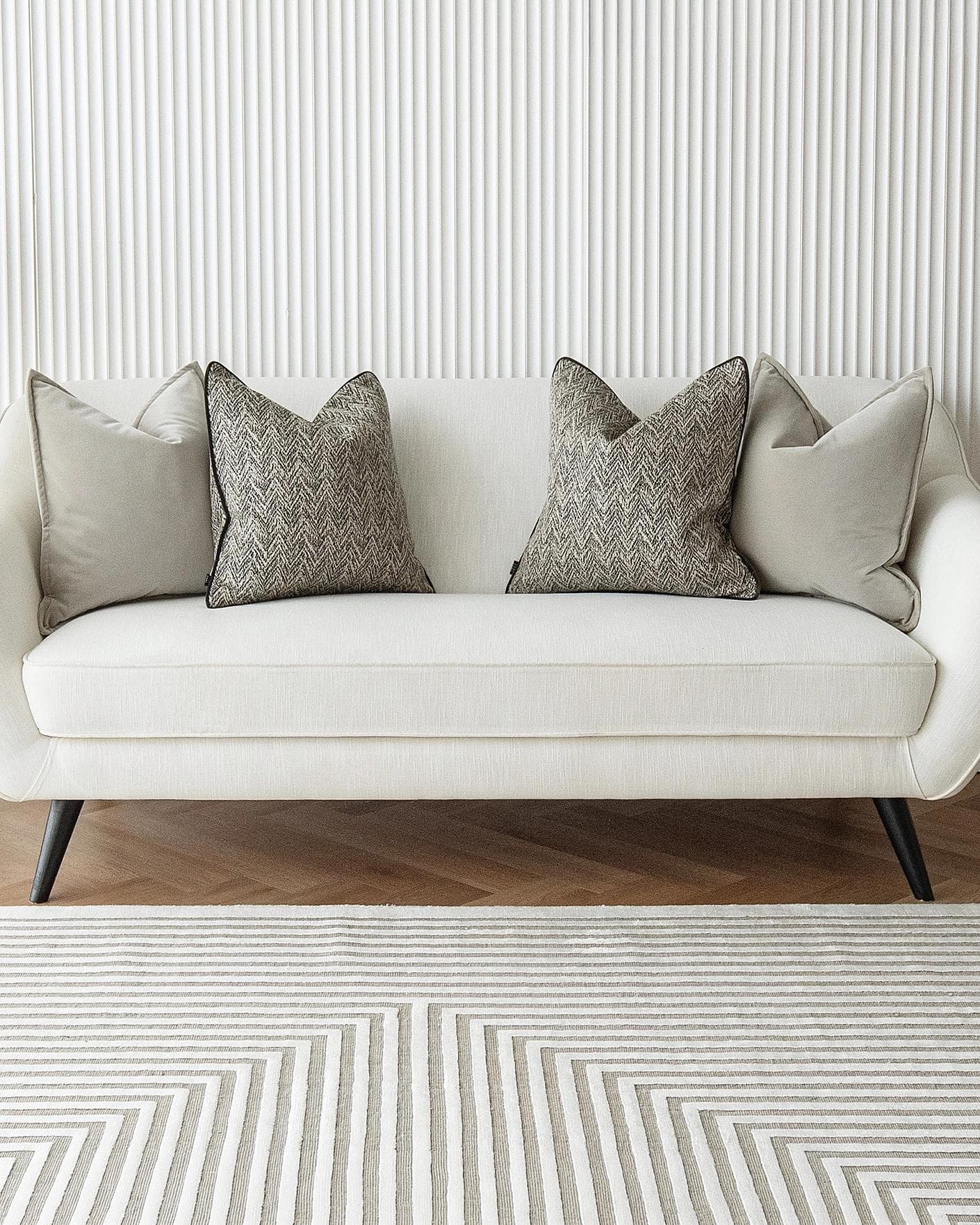 Marilee Bundle cushion in brown, grey and black, shown in a lifestyle front view as image 4