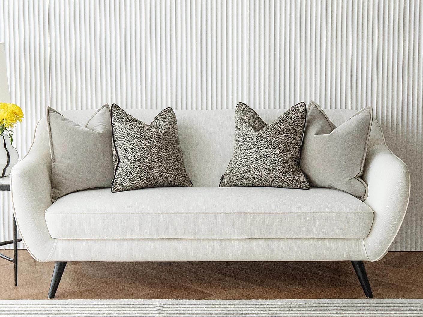Marilee Bundle cushion in brown, grey and black, shown in a lifestyle front view as image 4