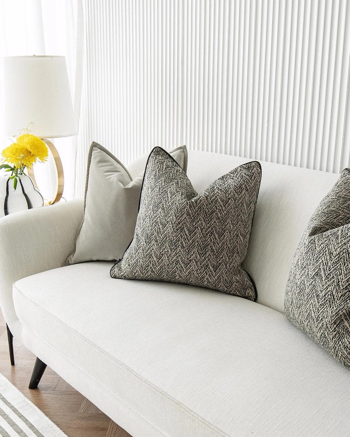 Marilee Bundle cushion in brown, grey and black, shown in a lifestyle right view as image 5