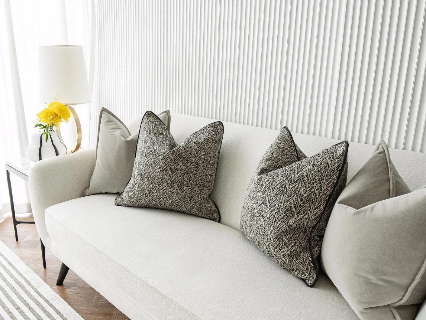 Marilee Bundle cushion in brown, grey and black, shown in a lifestyle right view as image 5