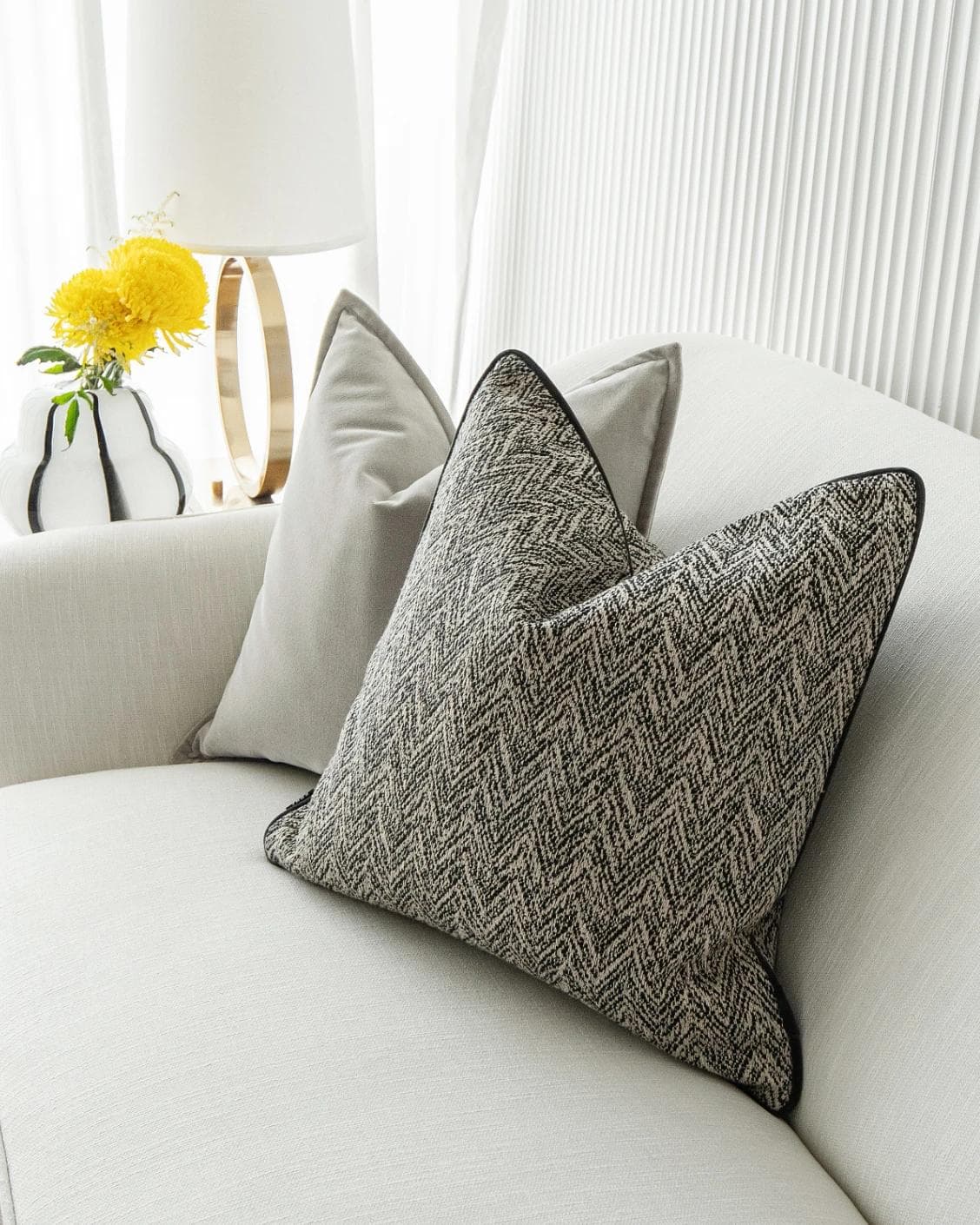Marilee Bundle cushion in brown, grey and black, shown in a lifestyle right view as image 6
