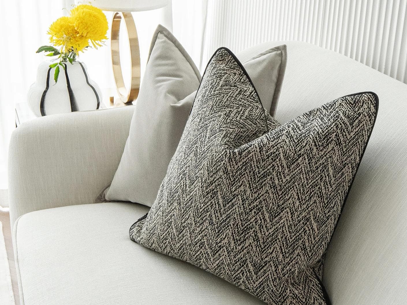 Marilee Bundle cushion in brown, grey and black, shown in a lifestyle right view as image 6