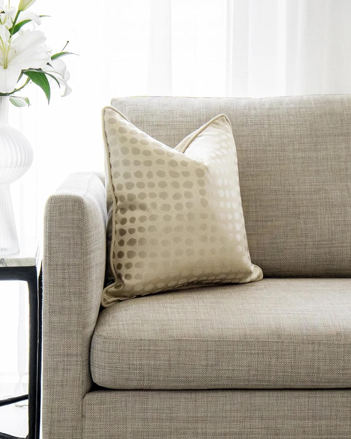 Marissa Bianca cushion in beige and silver, shown in a lifestyle front view as image 4