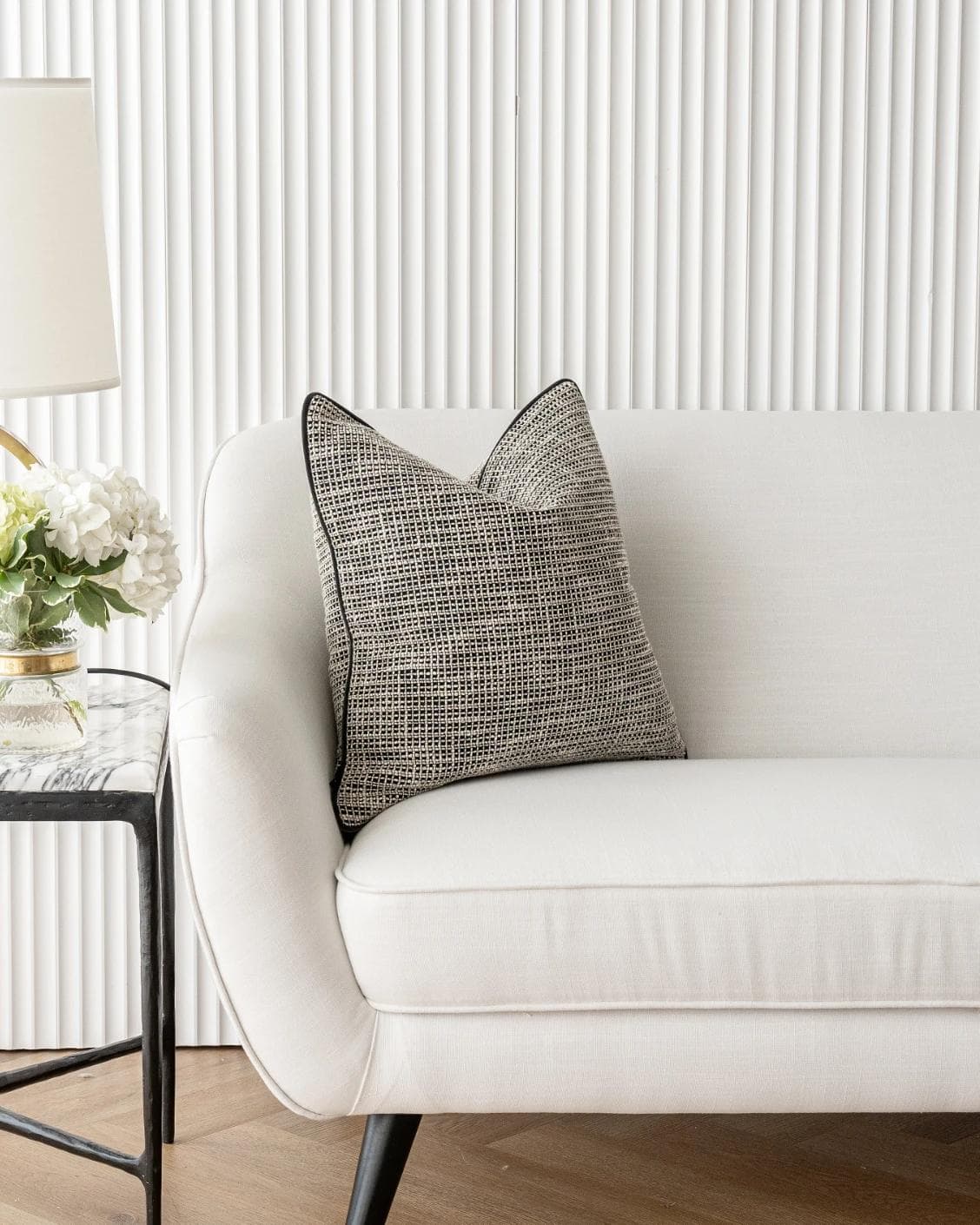 Marlee Steele cushion in black, shown in a lifestyle front view as image 4