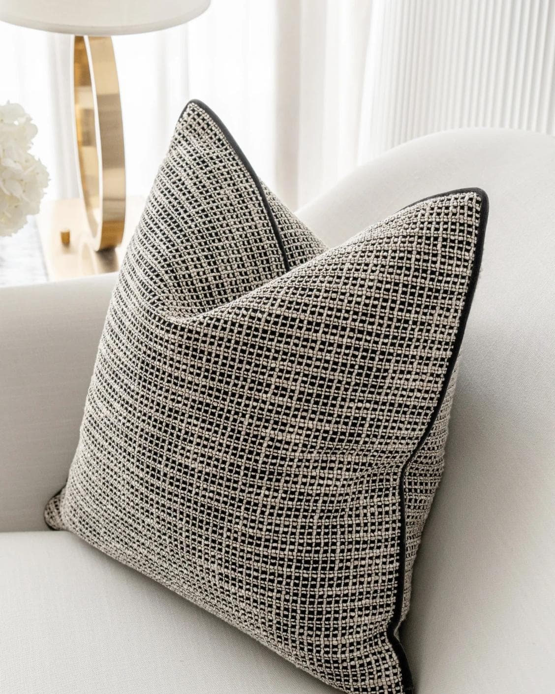 Marlee Steele cushion in black, shown in a lifestyle right view as image 5