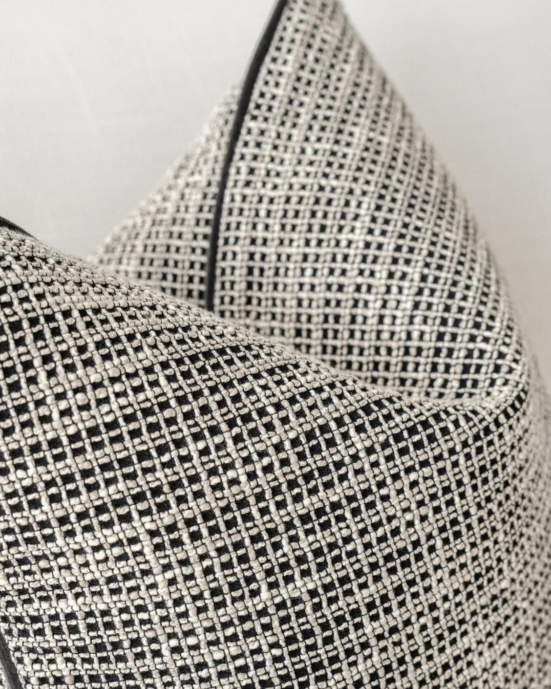 Marlee Steele cushion in black, shown in a product left view as image 6