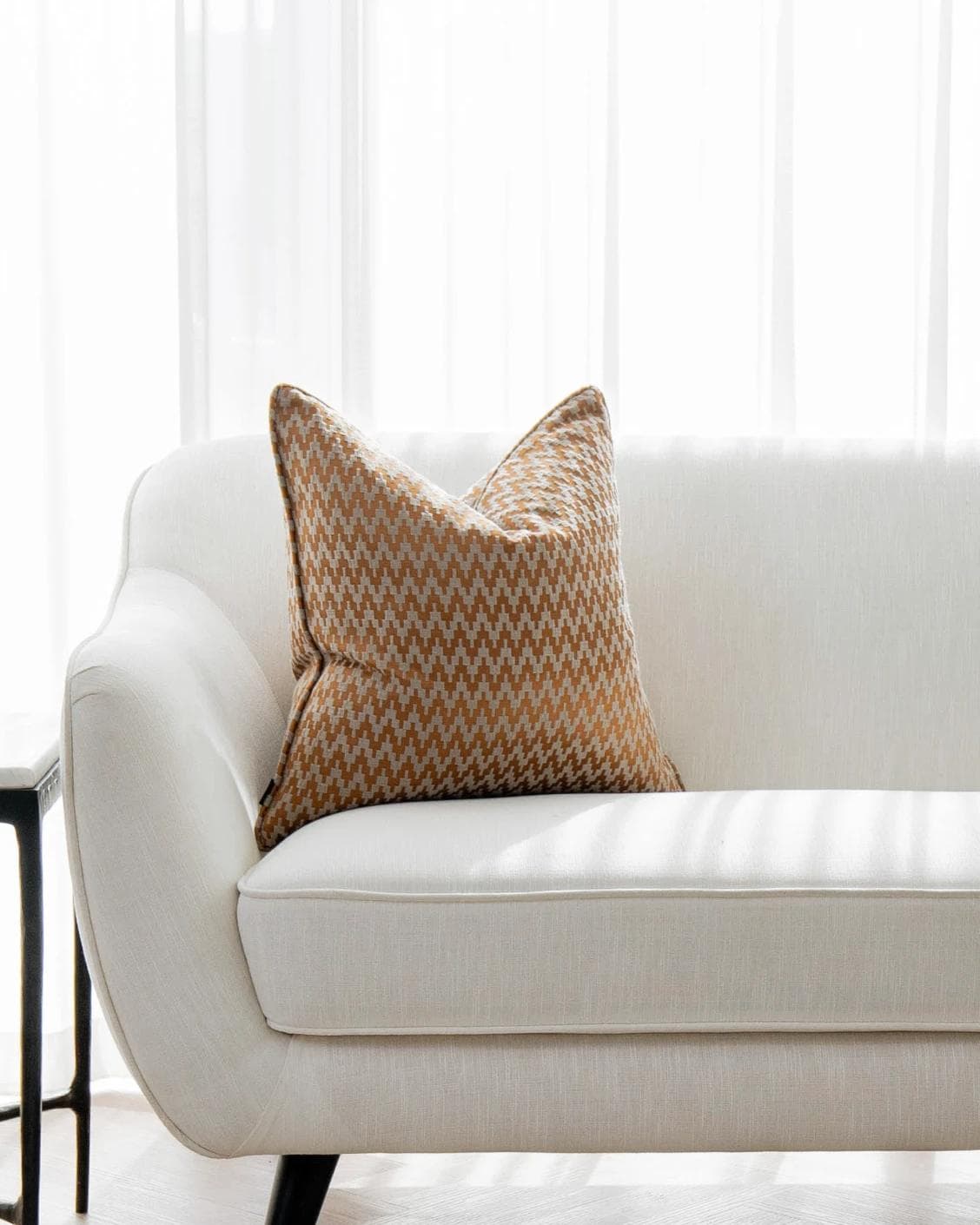 Maxene Hodler cushion in orange, shown in a lifestyle front view as image 4