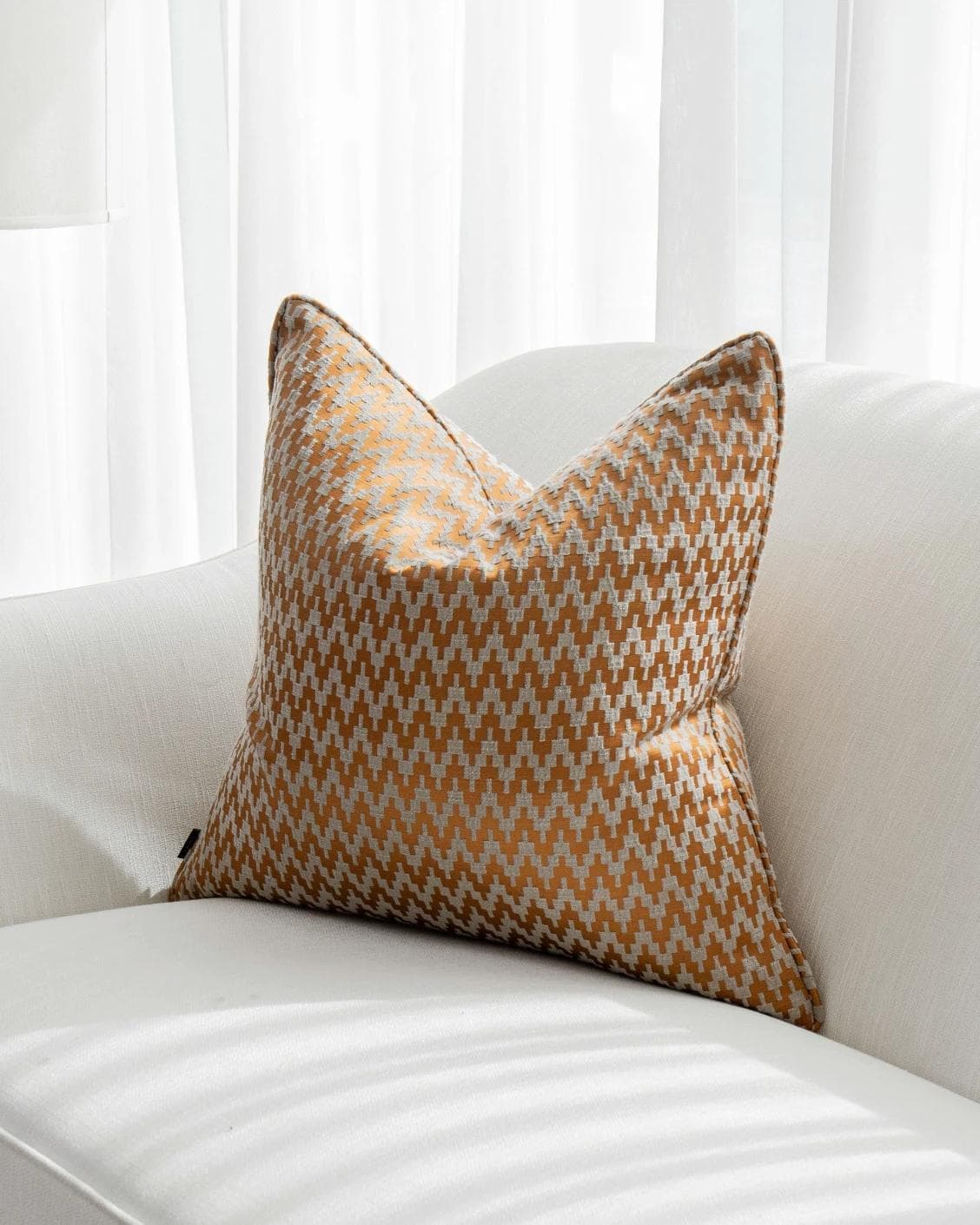 Maxene Hodler cushion in orange, shown in a lifestyle right view as image 2