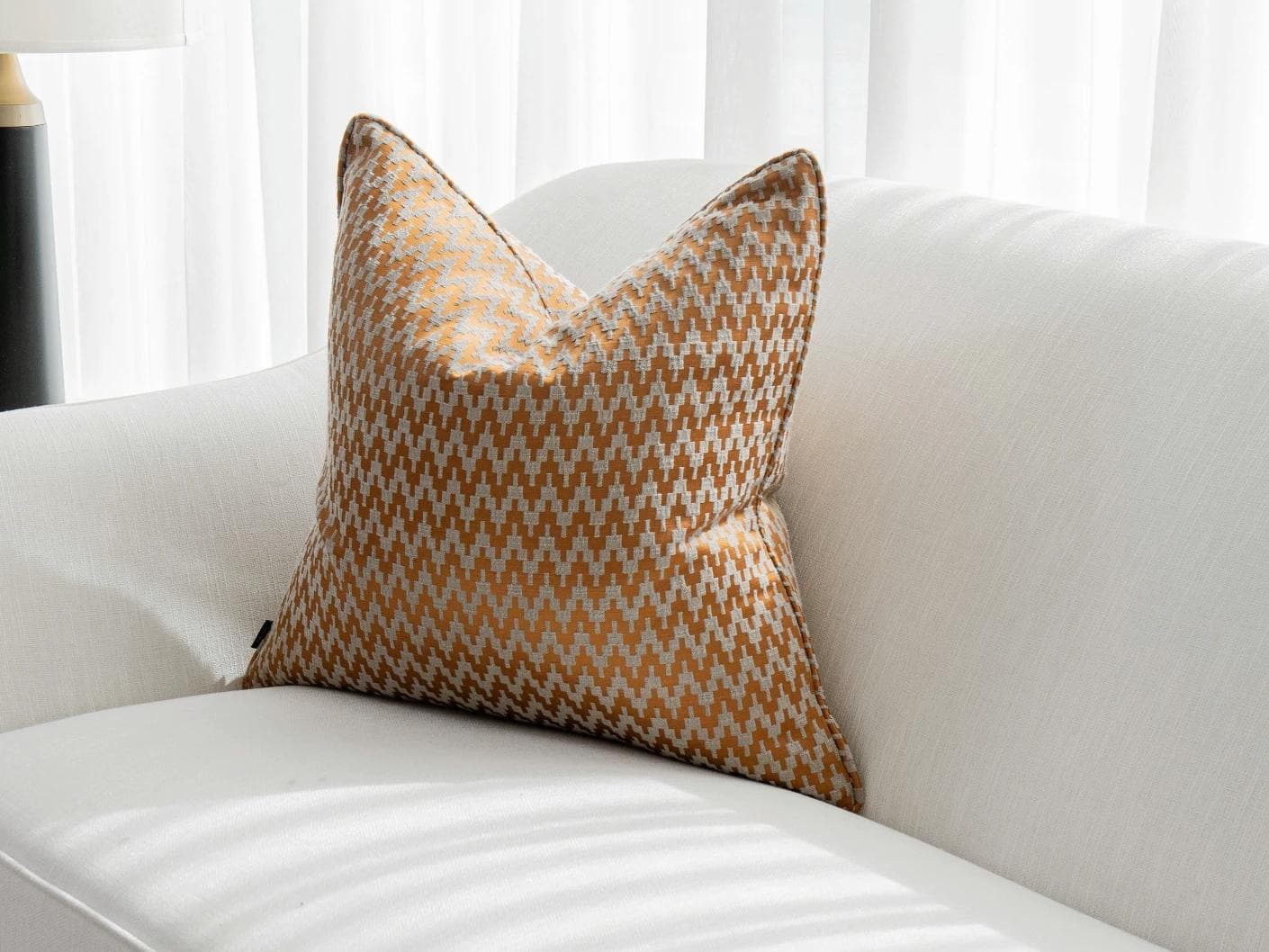 Maxene Hodler cushion in orange, shown in a lifestyle right view as image 2