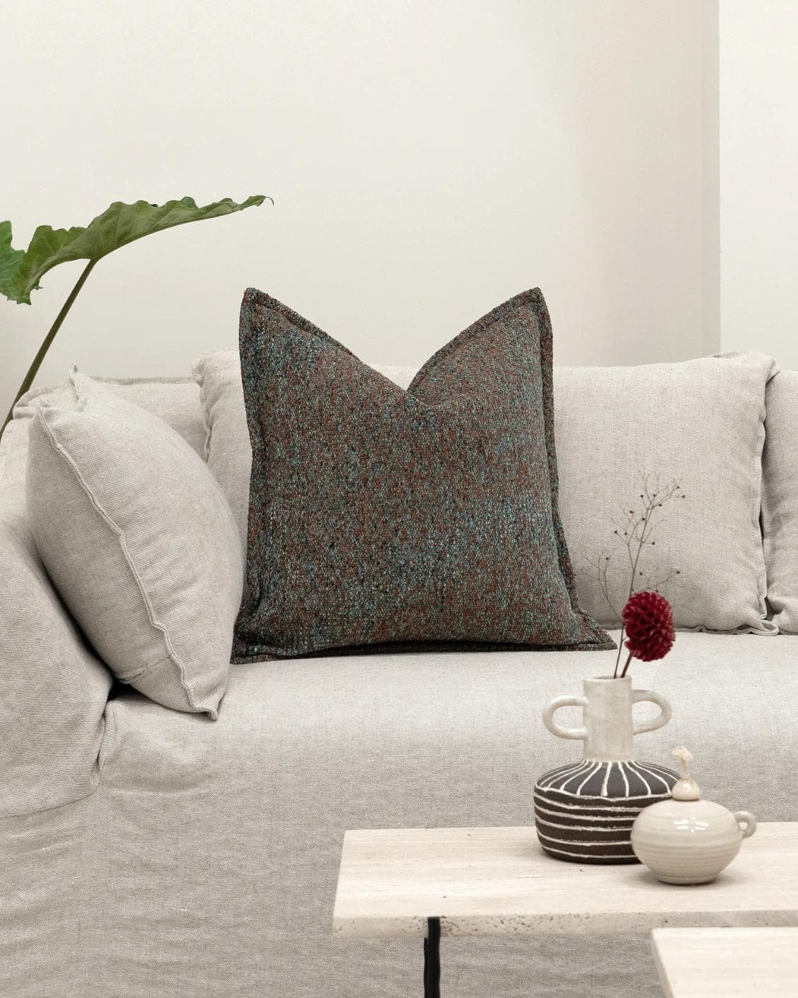 May Chromix cushion in blue and multicolour, shown in a lifestyle front view as image 4