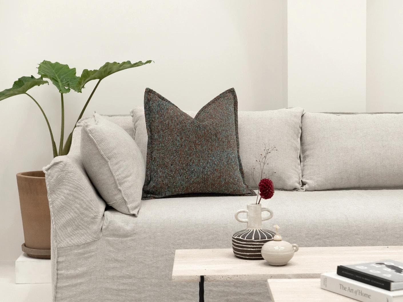 May Chromix cushion in blue and multicolour, shown in a lifestyle front view as image 4