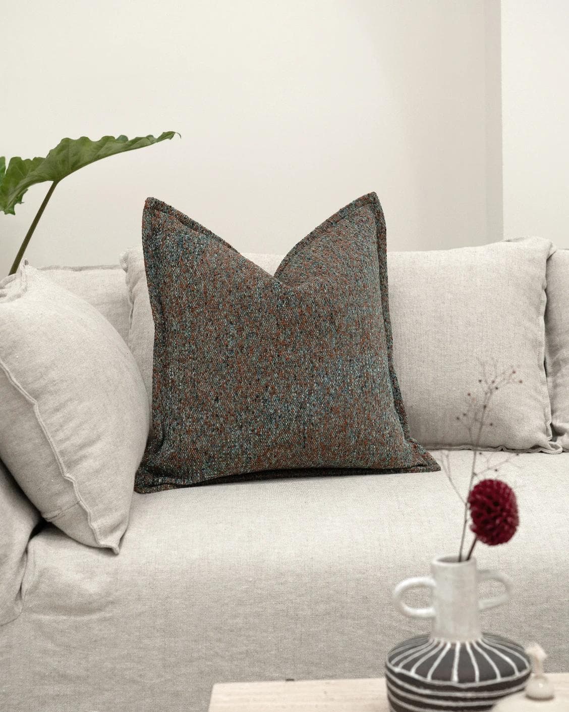 May Chromix cushion in blue and multicolour, shown in a lifestyle front view as image 2