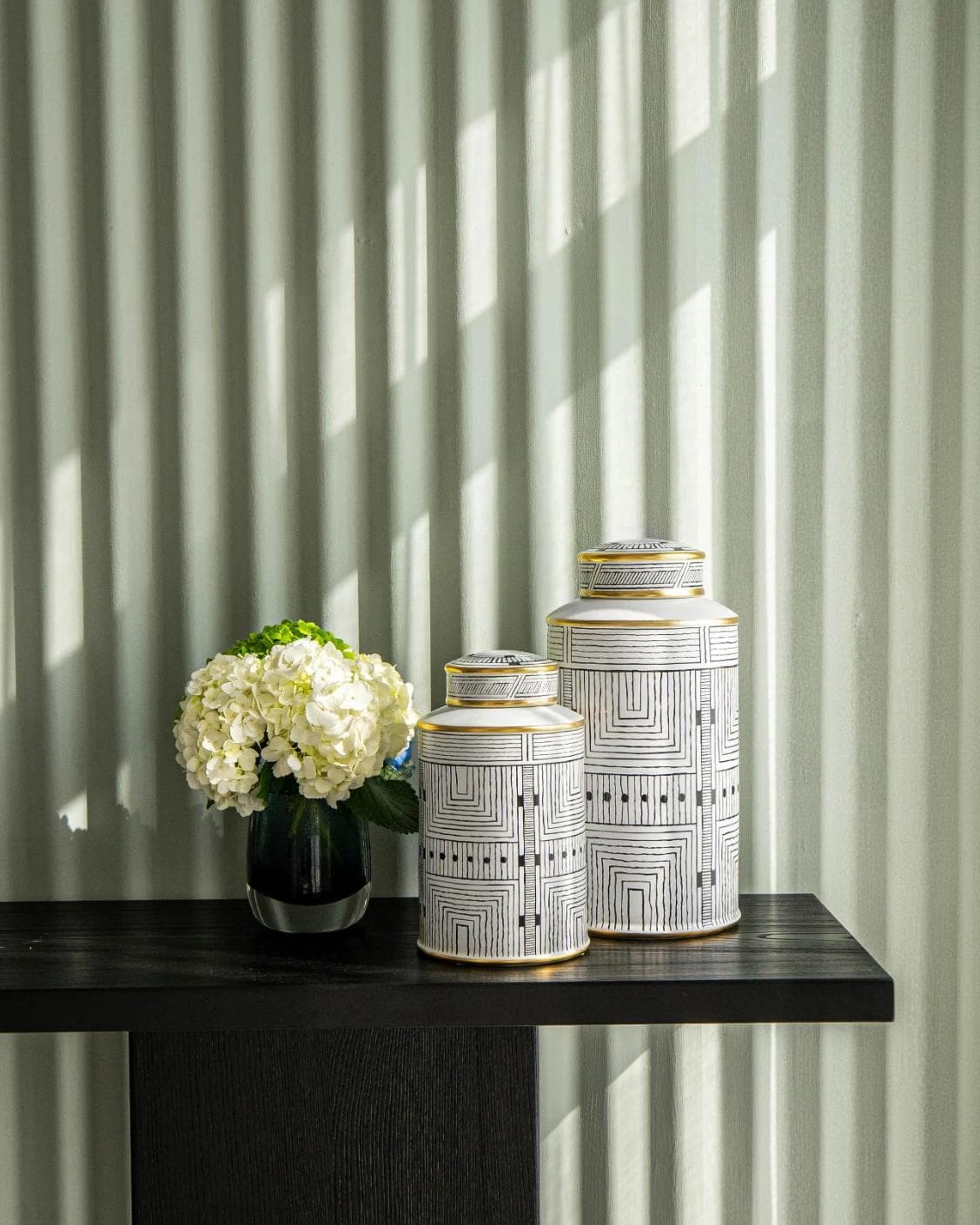 Maze Arneson canisters in black and white, shown in a lifestyle front view as image 7