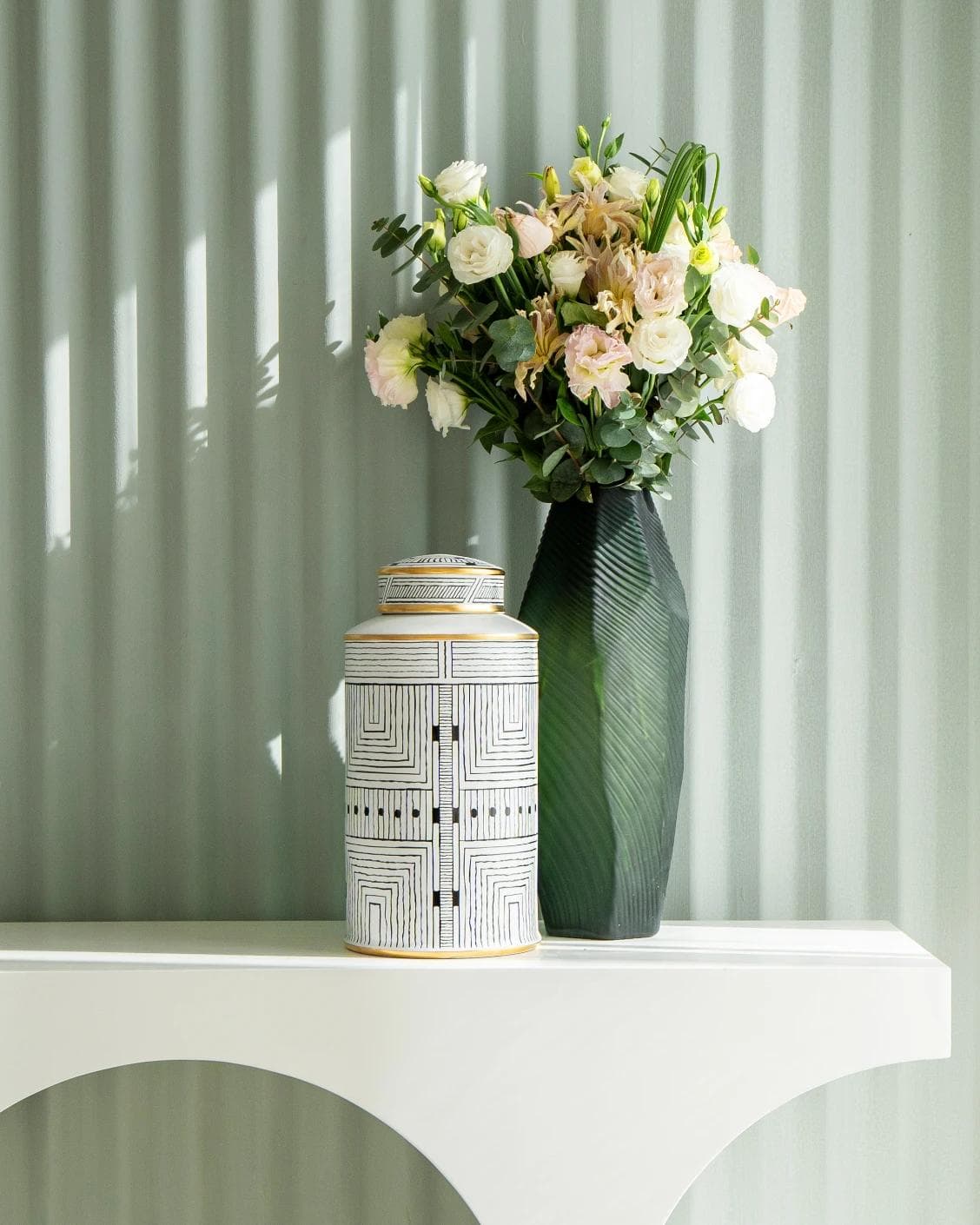 Maze Arneson canisters in black and white, shown in a lifestyle front view as image 8