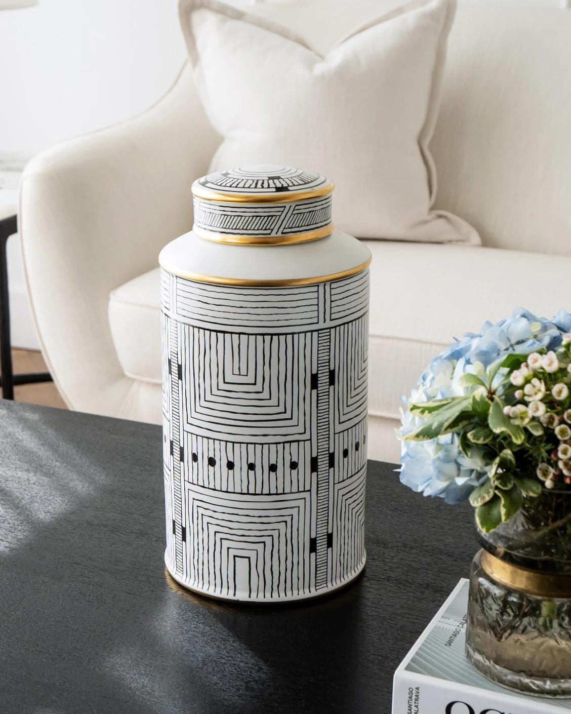 Maze Arneson canisters in black and white, shown in a lifestyle front view as image 2