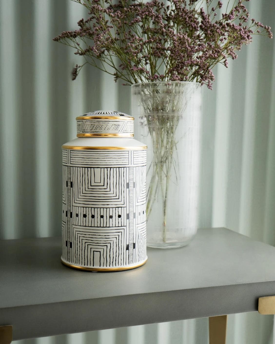 Maze Arneson II canisters in black and white, shown in a lifestyle front view as image 2