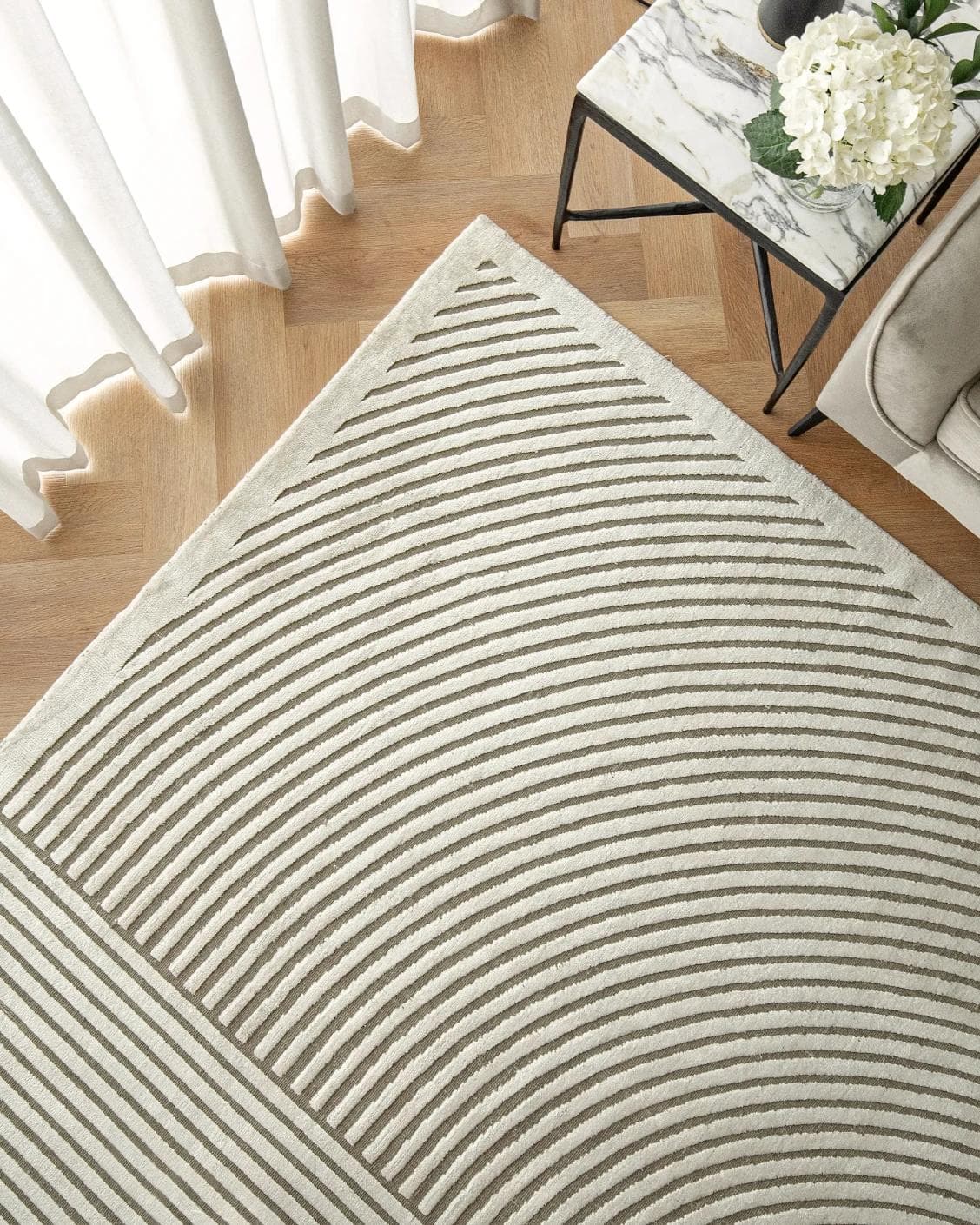 Maze Sandy carpet in beige, shown in a lifestyle top view as image 2