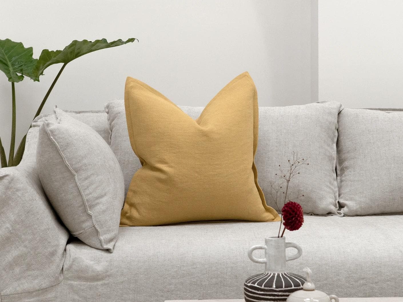 Mel Barrymore cushion in yellow, shown in a lifestyle front view as image 4