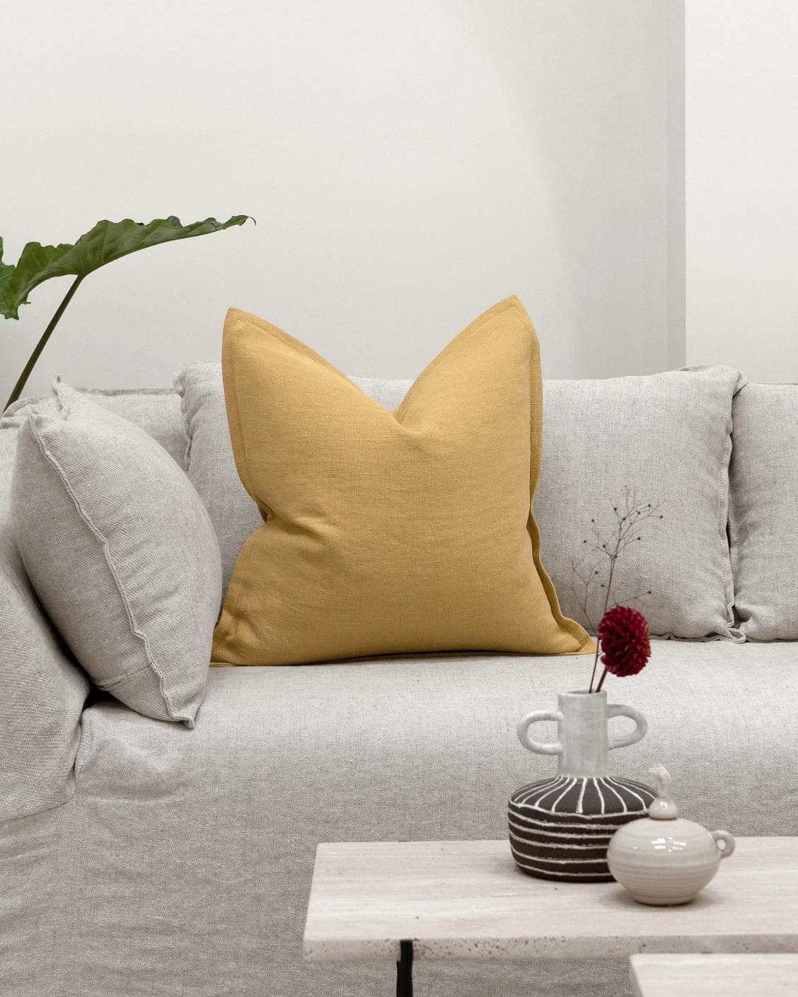 Mel Barrymore cushion in yellow, shown in a lifestyle front view as image 4