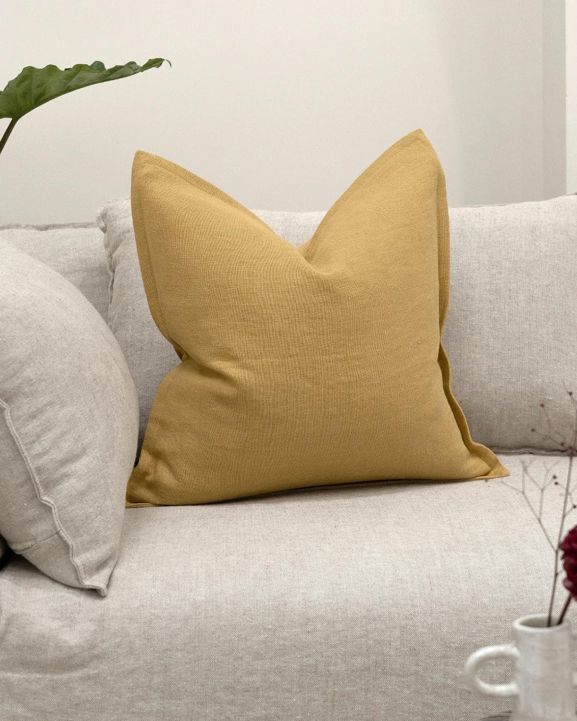 Mel Barrymore cushion in yellow, shown in a lifestyle front view as image 5