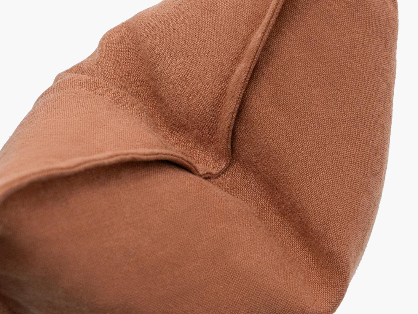 Mel Brick cushion in rust, shown in a product close-up as image 7